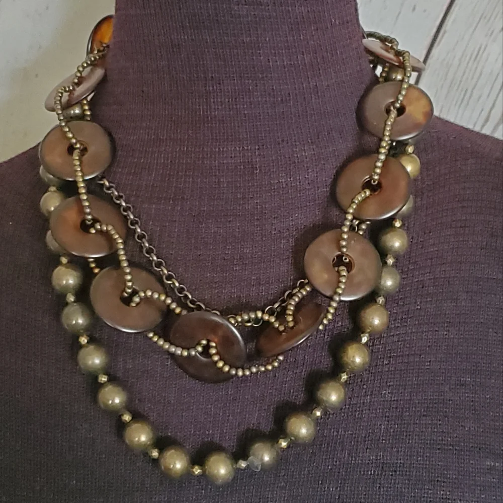 Bronze tone three strand necklace with tortoise shell look circles, brown